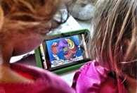 Photo of toddlers with a tablet. Photo by Wayan Vota